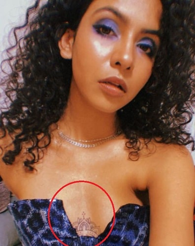 Himika Bose's tattoo on cleavage