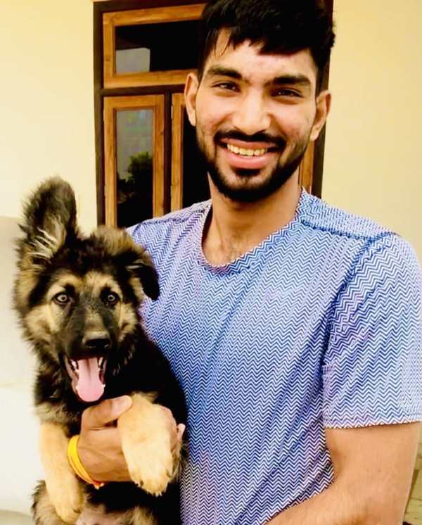 Jitendra Yadav with a puppy