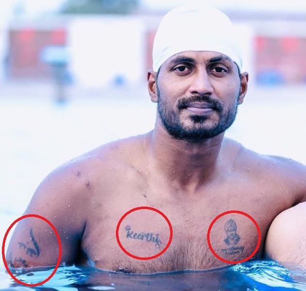 K Prapanjan's tattoos on his chest and right bicep