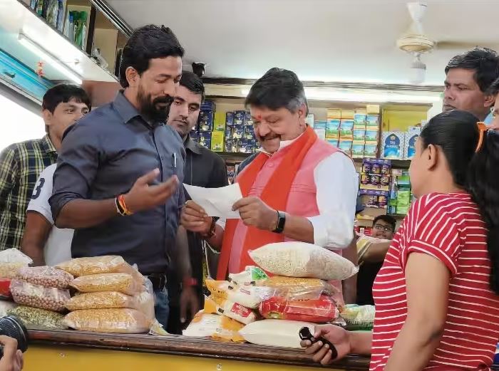 Kailash Vijayavargiya selling food items at his traditional grocery shop in Indore on the occasion of Dhanteras