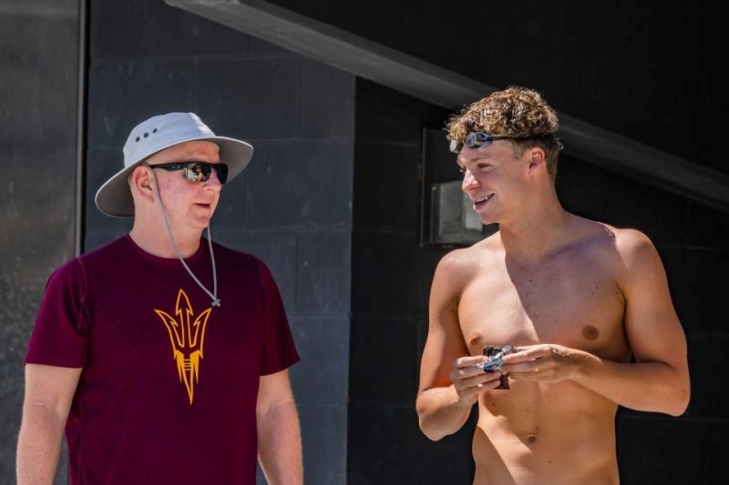 Léon Marchand says he chose to swim at ASU so he could train under Bob Bowman (left), who had coached Michael Phelps