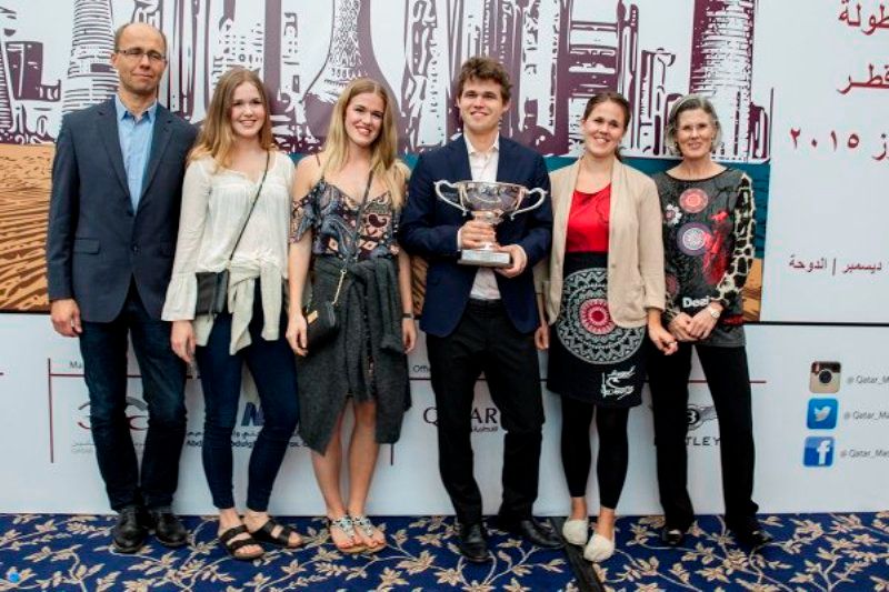 Magnus Carlsen (3rd from right) with his parents and sisters