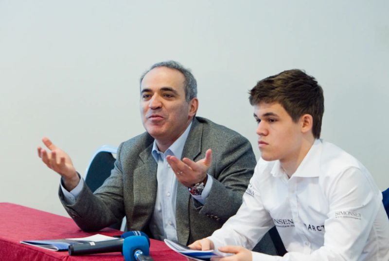 Magnus Carlsen with Garry Kasparov (left)