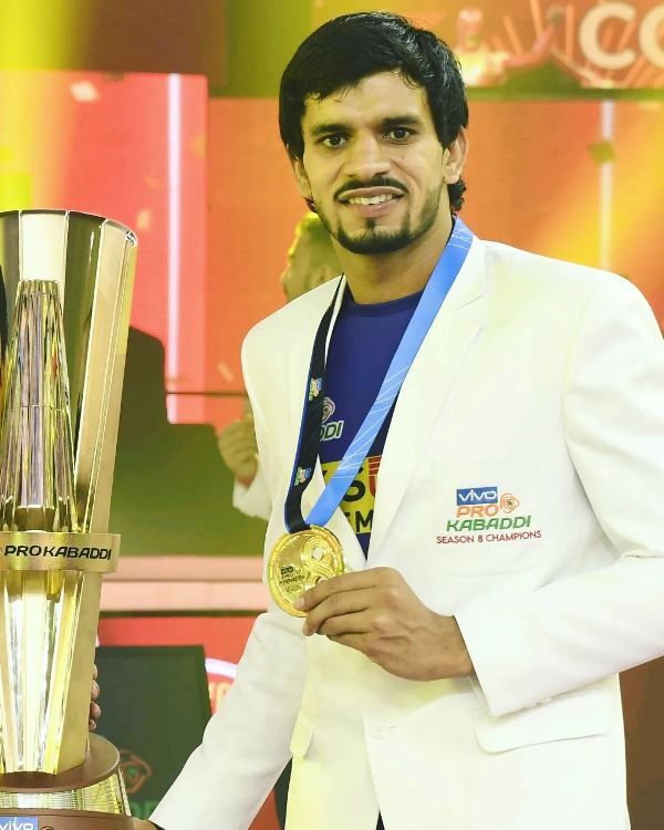 Neeraj Narwal with his medal and trophy