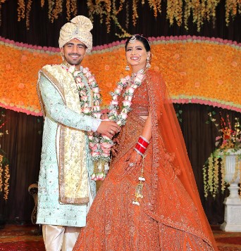 Nitin Rawal with his wife on their wedding day