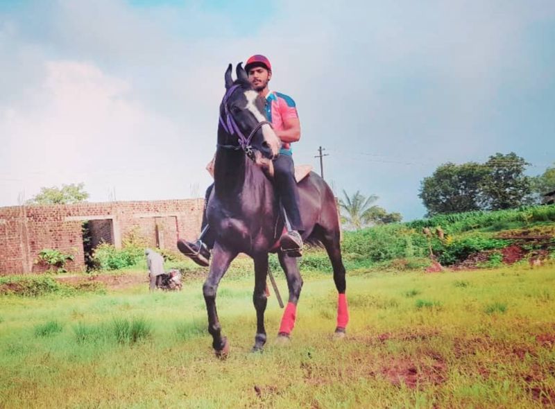 Omkar R. More doing horseback riding