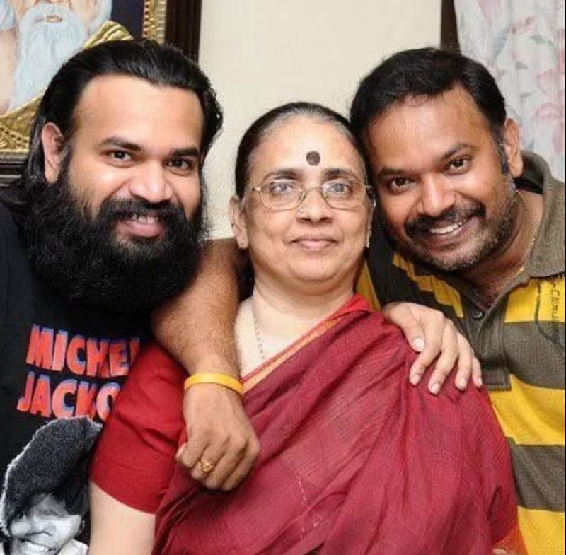 Premgi Amaren (left) with his mother (centre) and brother (right)