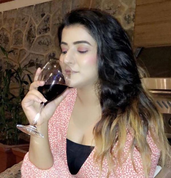 Priya Singh drinking wine