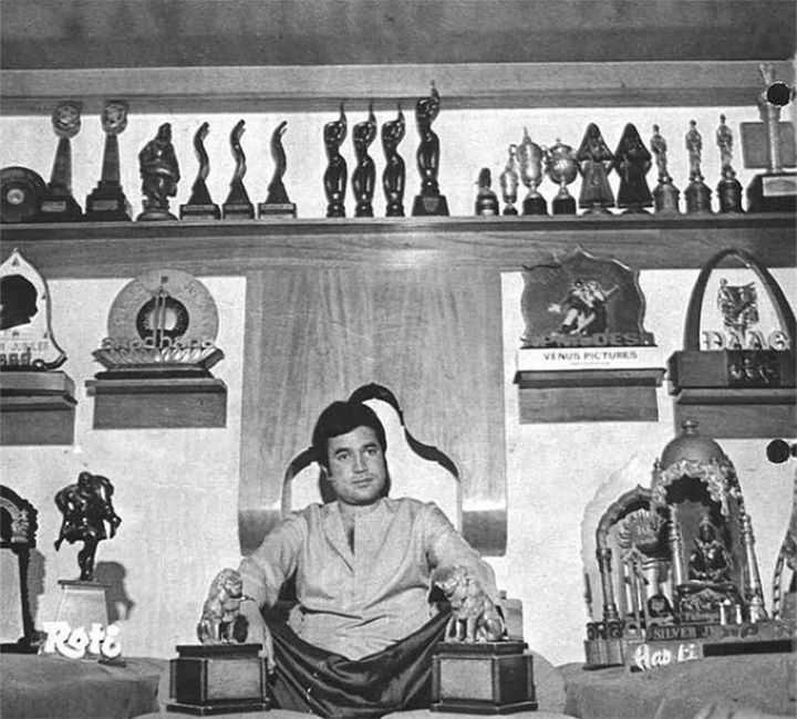 Rajesh Khanna posing with his numerous awards