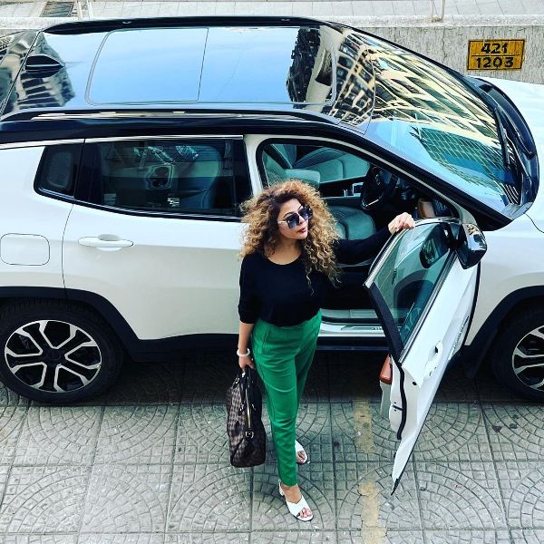 Rajshree More while posing with her Jeep Compass