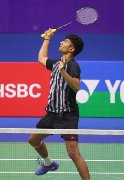 Sai Pratheek mid-game on the badminton court