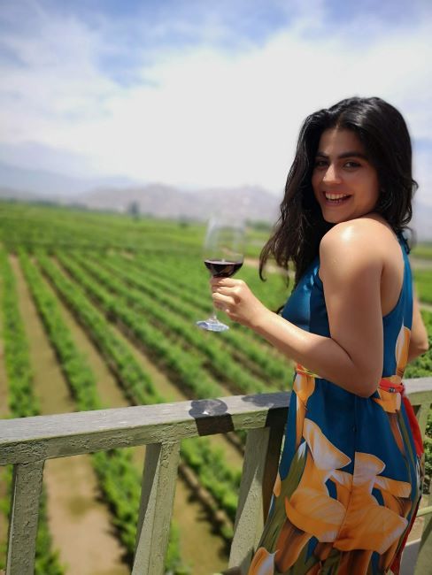 Shenaz Treasury with an alcoholic beverage