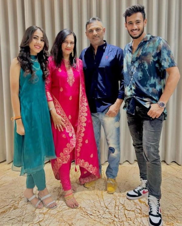 Sitanshu Kotak with his wife and children