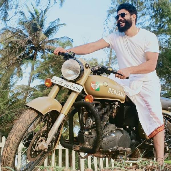 Vajrang Shetty sitting on his bike