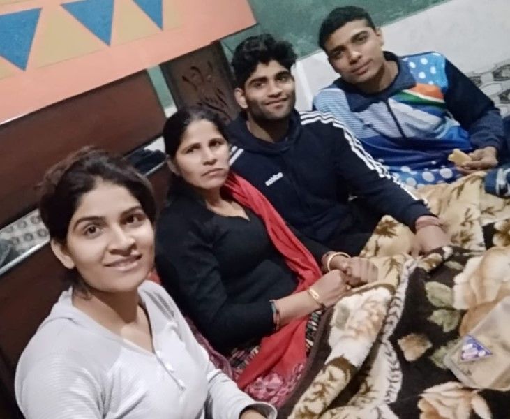 Vinay with his sister, mother, and brother