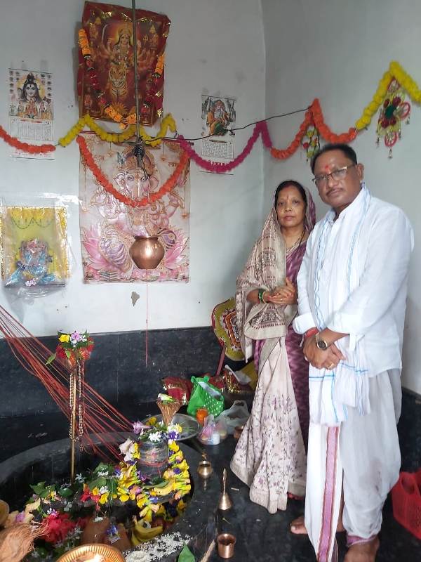 Vishnu Deo Sai and his wife praying in a temple