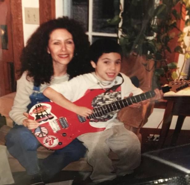 A childhood photograph of Benny Blanco with his mother