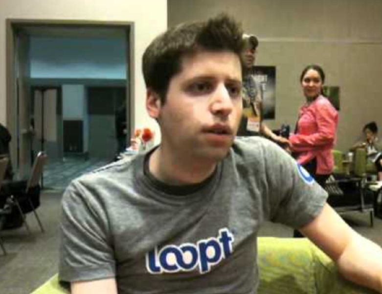 A picture of Sam Altman when he was the CEO of Loopt, wearing a t-shirt with the logo of Loopt
