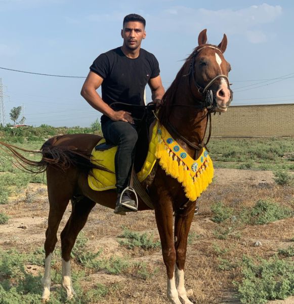 Amirhossein Bastami enjoying riding his horse