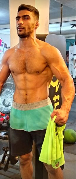 Amirhossein Bastami working out at the gym