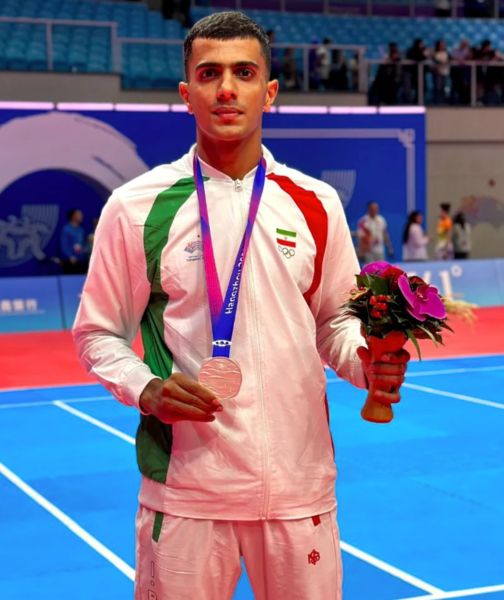 Amirmohammad Zafardanesh posing with the silver medal at the 19th Asian Games in China in 2023