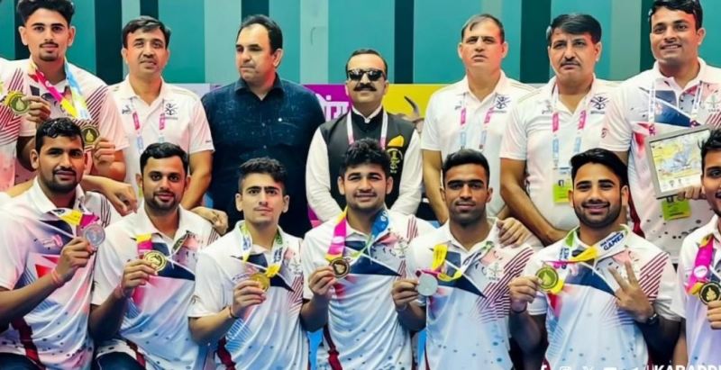 Ankush Rathee (siting in centre) posing with his team at the 37 National Games in Goa