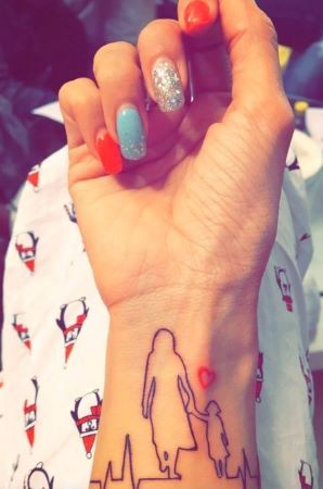 Another tattoo on Kishwer's arm