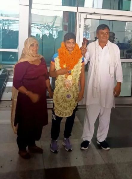 Antim with her parents