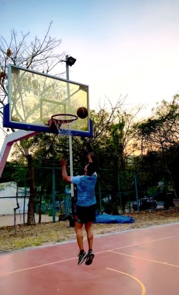Ashu Singh playing basketball during his leisure time