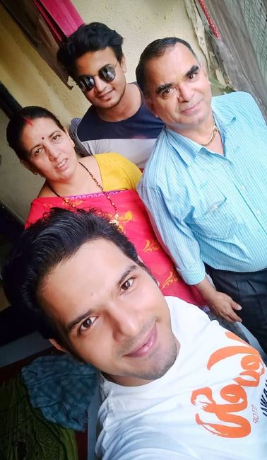 Basant Bhatt with his parents and brother