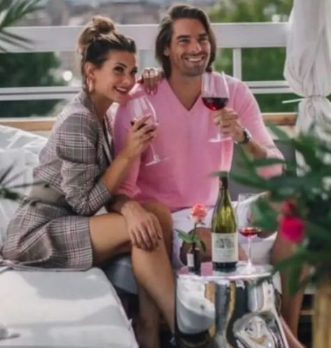 Camille drinking wine with his wife