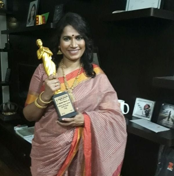 Chhaya Kadam while holding an award