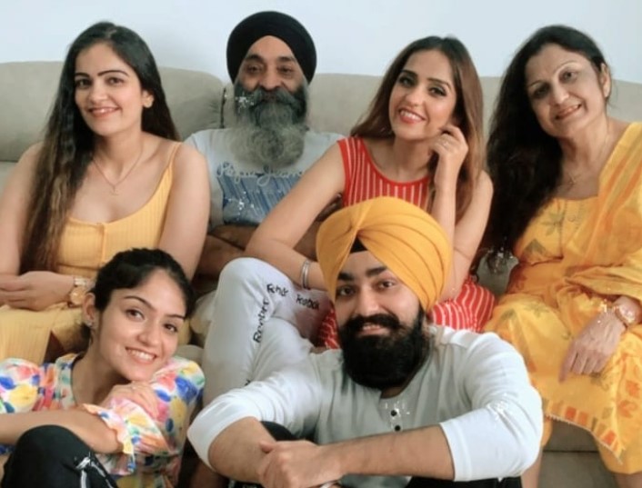 Deedar Kaur (extreme left; on sofa) with her family