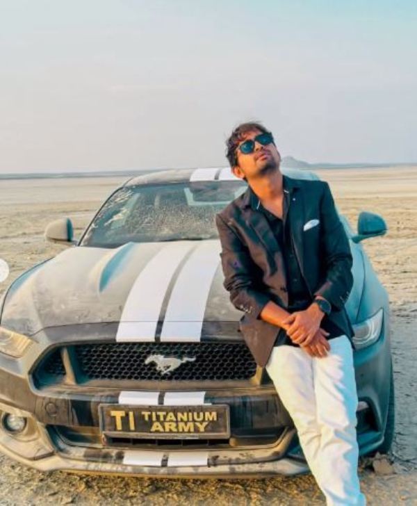 Dilraj Singh Rawat posing with his Ford Mustang GT Fastback 5.0L 
