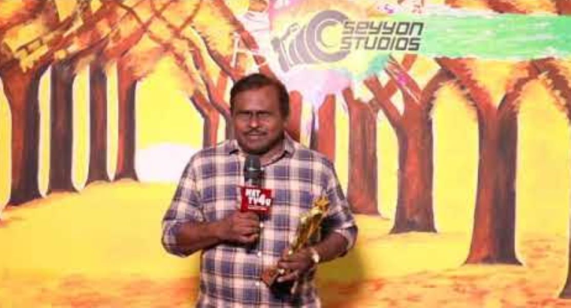 George Maryan holding MVT Film Excellence Award