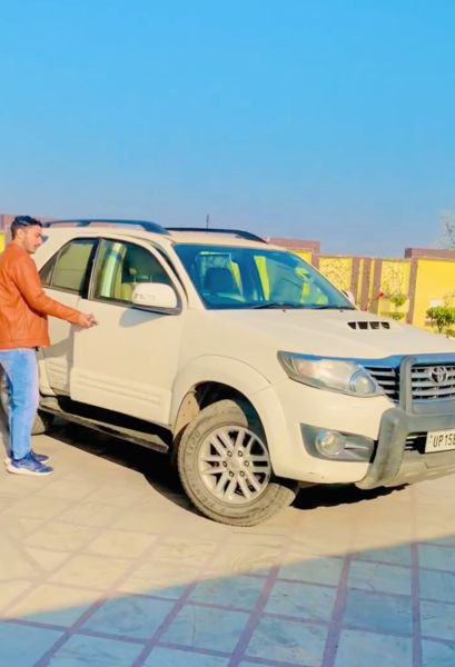 Gulveer Singh with his car Toyota Fortuner