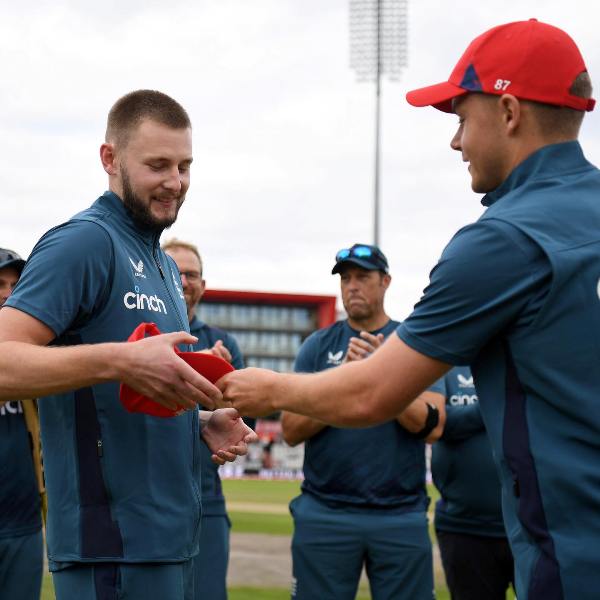 Gus Atkinson being given his T20I cap by Sam Curran on his T20I debut