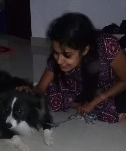 Haritha G. Nair with a dog