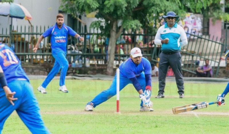 Illuri Ajay Kumar Reddy doing wicketkeeping during a match