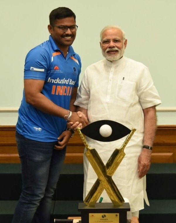 Illuri Ajay Kumar Reddy with Narendra Modi after winning the 2017 Blind T20 World Cup