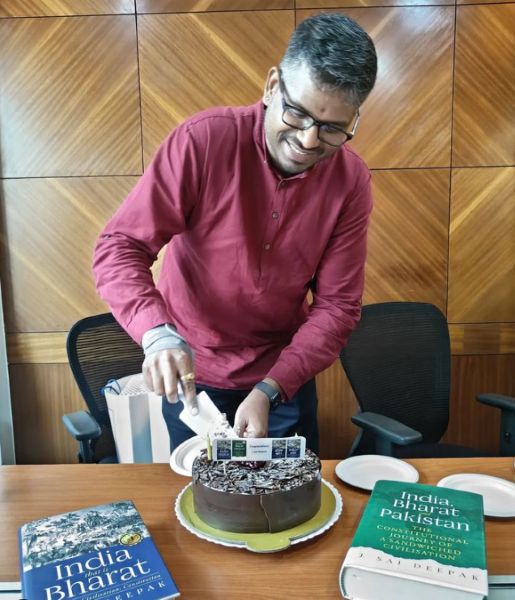 J. Sai Deepak celebrating the sale of about 2,00,000 copies of his books