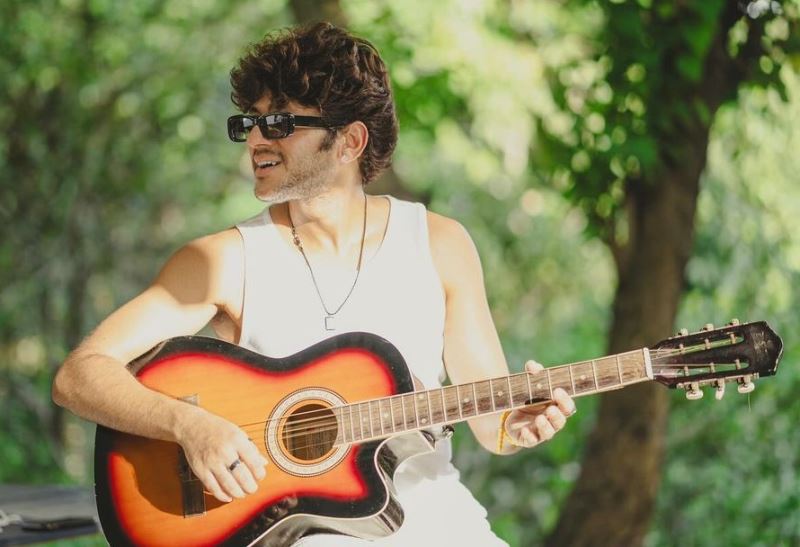 Karan Sharma playing a guitar