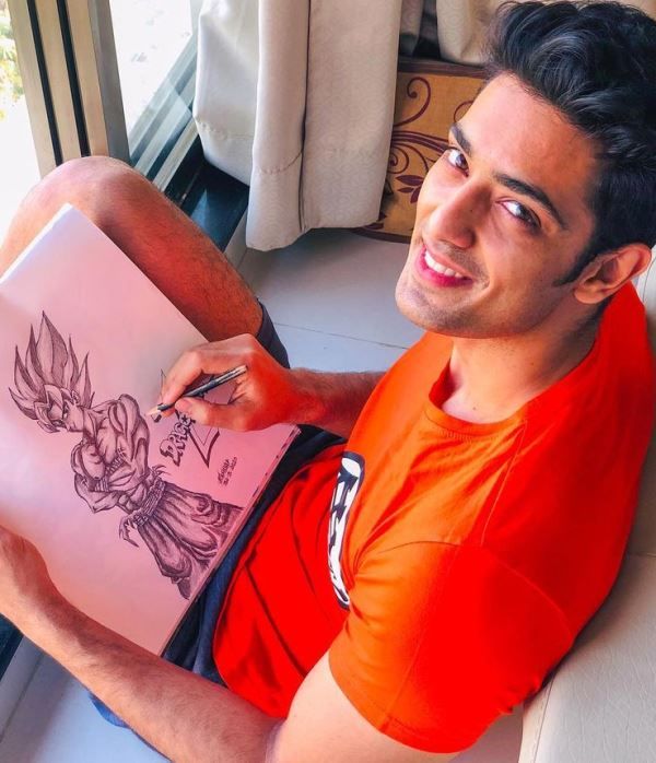 Kashyap Barbhaya while drawing cartoon characters