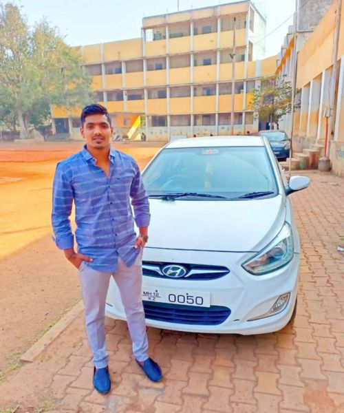 Kiran Magar posing with his car