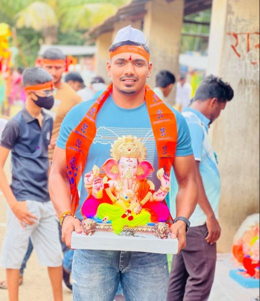 Kiran Magar with the idol of lord Ganesha during Ganesh Chaturthi