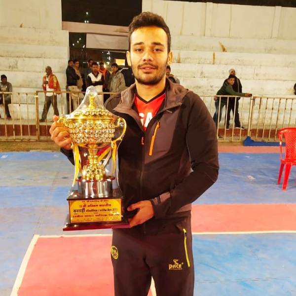 Mahendra Choudhary posing with the trophy after winning the 55th Akhil Bhartiya Kabaddi Championship