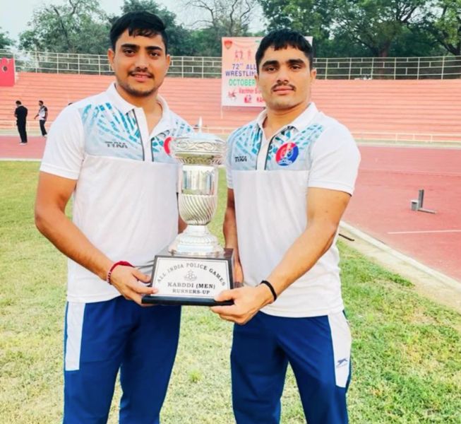 Mahipal Sinwar (left) posing with the runners-up trophy of the All India Police Games (2023)