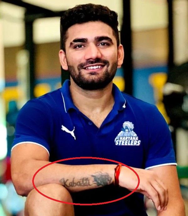 Monu Hooda's tattoo on his right arm