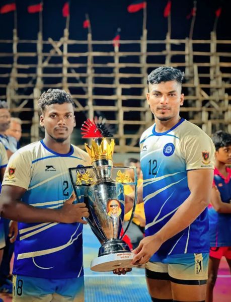 Mukilan Shanmugam (left) posing with the winning trophy of the All India Railway Kabaddi Championship in 2023