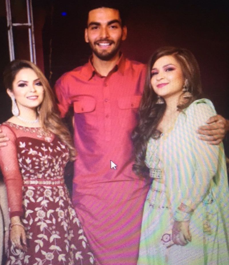 Nikhil Chaudhary with his sisters Pooja (left) and Aarti (right)